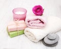 Bath towels, candle and soap with pink roses Royalty Free Stock Photo