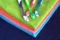 Bath towels of different colors and toothbrushes closeup Royalty Free Stock Photo