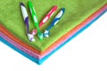 Bath towels of different colors and toothbrushes isolated Royalty Free Stock Photo