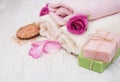 Bath towels and soap with pink roses Royalty Free Stock Photo