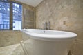 Bath tub detail with stone tiled walls Royalty Free Stock Photo