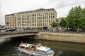 Bath University on the River Avon with a passing pleasure boat Royalty Free Stock Photo