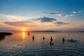 Bather`s silhouettes at sunset in Lake Balaton, Hungary Royalty Free Stock Photo