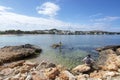 Bathers shallow water rocky coastal landscape Mallorca