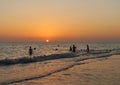 Bathers in the sunset, CÃÂ¡diz coast, Andalusia, Spain Royalty Free Stock Photo