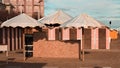 A bathhouse with white sun umbrellas on the beach of the Mediterranean Sea Italy, Europe Royalty Free Stock Photo