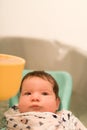 Bathing a baby. bathes her son in a small plastic bath Royalty Free Stock Photo