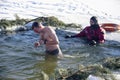 bathing in the hole for baptism, Ukraine, Chernigov.