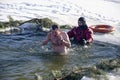 Bathing in the hole for baptism, Ukraine, Chernigov.