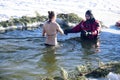 bathing in the hole for baptism, Ukraine, Chernigov.