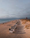 The bathing huts at Blokhus Beach, Denmark during sunset.