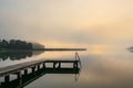 Bathing jetty at the lake Schaalsee during sunrise in Seedorf, Germany