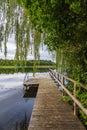 Bathing jetty at the lake Schaalsee with trees in Seedorf, Germany