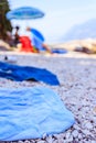 Bathing towel on the beach, other people in blurry background