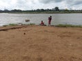 The bathing of village women in the river Ajay causing river pollution ,at Birbhum