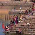 Bathing and washing at the local ghat at Khajuraho, India