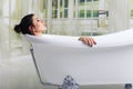 Bathing woman relaxing in bath smiling relaxing with eyes closed Royalty Free Stock Photo