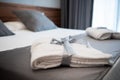 Bathrobe On Bed In Hotel Room