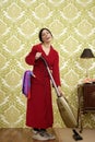 Bathrobe retro housewife woman vacuum cleaner Royalty Free Stock Photo