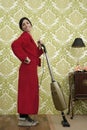 Bathrobe retro housewife woman vacuum cleaner Royalty Free Stock Photo