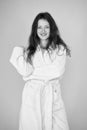 This bathrobe suits her natural beauty. Sensual woman after beauty treatment and wellness therapy. Pretty young woman