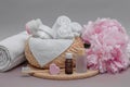 Bathroom accessories on the table, towels, white towels for face and body, toothbrush, cosmetic set, face and body care