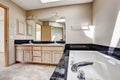 Bathroom with black granite tile trim