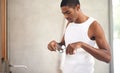 Bathroom, black man and toothpaste for teeth, cleaning and oral hygiene of mouth, dental and health. Male person, self Royalty Free Stock Photo