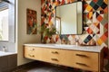 a bathroom with colorful, patterned tile and a floating vanity