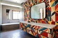 a bathroom with colorful, patterned tile and a floating vanity