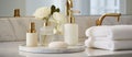 Bathroom counter has towels, soap, lotion, and flowers Royalty Free Stock Photo