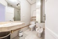 Bathroom with cream marble vanity and white porcelain sink Royalty Free Stock Photo