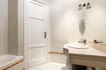 Bathroom with cream marble vanity and white porcelain sink Royalty Free Stock Photo