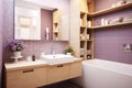 Bathroom design. The bathroom is lined with purple tiles. The room has a wooden cabinet, a mirror and a bathtub.