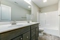 Bathroom with double vanity and white fixtures.