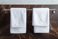 Bathroom elegance White towel hanging in a marble tiled wall bathroom