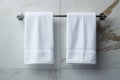 Bathroom elegance White towel hanging in a marble tiled wall bathroom
