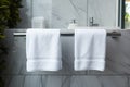 Bathroom elegance White towel hanging in a marble tiled wall bathroom