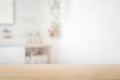 Bathroom empty tabletop wooden shelf for product display with blurred shower interior. Blurred background Royalty Free Stock Photo