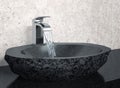 Bathroom faucet and black stone sink