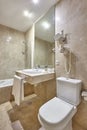 Bathroom finished in marble. Shower, lavatory and washhand basin Royalty Free Stock Photo