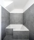 Bathroom with grey tiles in a small apartment Royalty Free Stock Photo