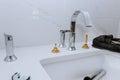 Bathroom installation of elegant interior with sink and faucet Royalty Free Stock Photo