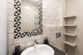 Bathroom interior with black and white tiles Royalty Free Stock Photo