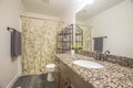 Bathroom interior of a home with gray wood floor and white wall Royalty Free Stock Photo