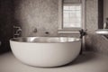 Bathroom interior with large round bathtub with faucet and window.