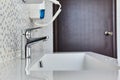 Bathroom interior with sink and faucet.