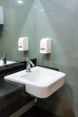 Bathroom interior with sink and soap dispencer