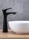 Bathroom interior with stylish black sink and marble washbasin, modern concrete walls Royalty Free Stock Photo