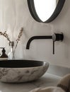 Bathroom interior with stylish black sink and marble washbasin, modern concrete walls Royalty Free Stock Photo